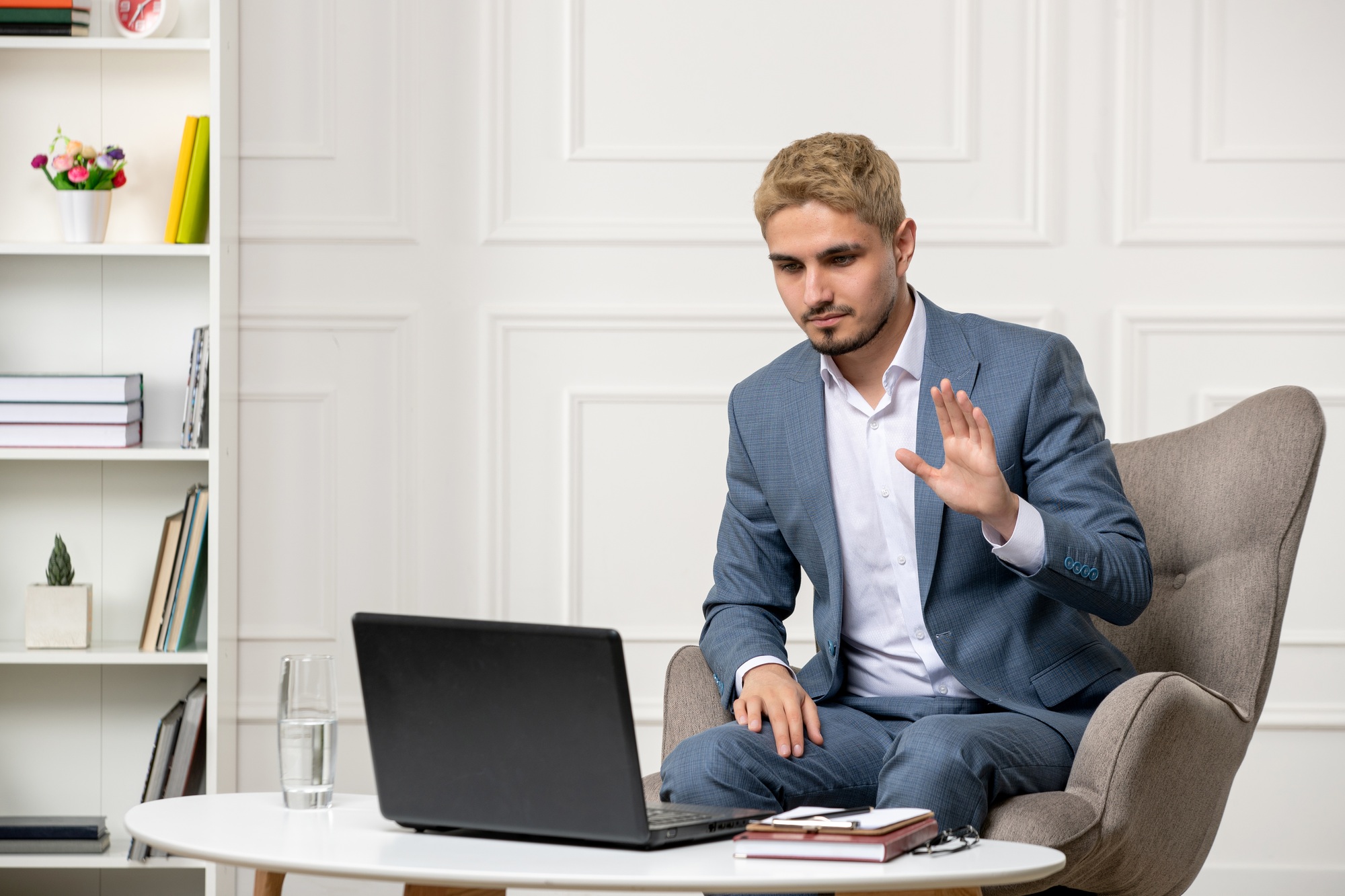 psychologist cute handsome young professional guy running online sessions saying goodbye